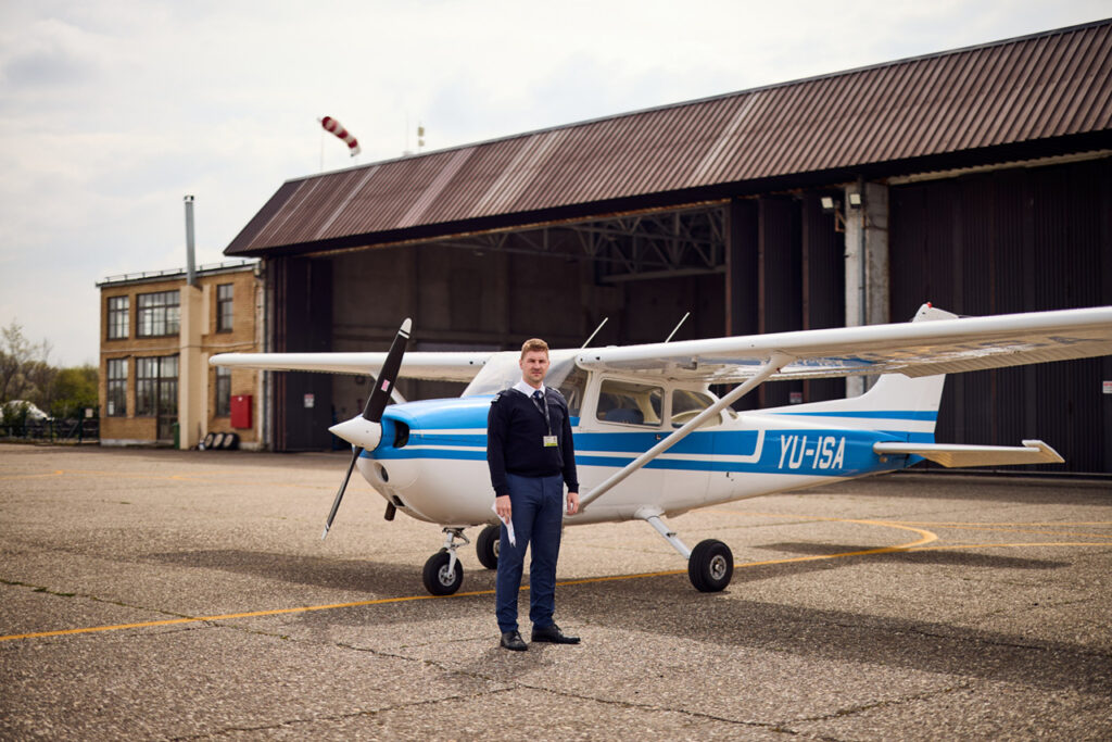 Instructor in front of the plane before take off